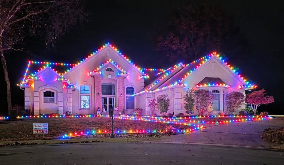 Home with multicolor roofline and driveway lights